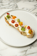 Vegetarian bruschetta with tomatoes and sour cream