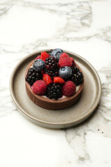 Tartlet with raspberries, blueberries and strawberries