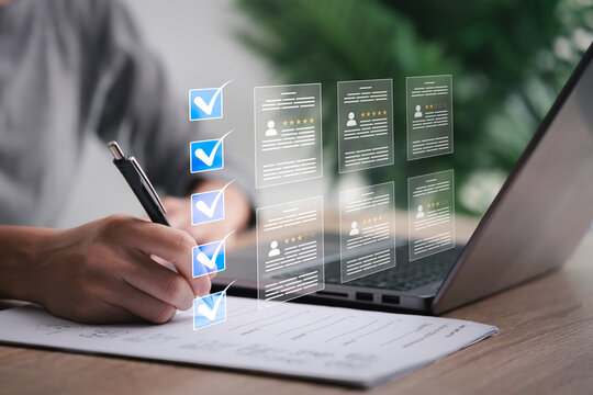 Education technology and smart business document concept, Businesswomen place a checkmark on the check block box check documents online Rating scale of individuals and test takers.