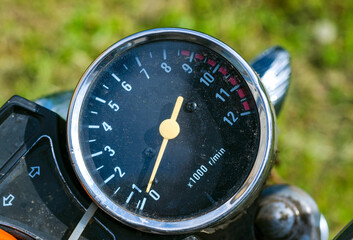 black dial shows the speed of the motorcycle.