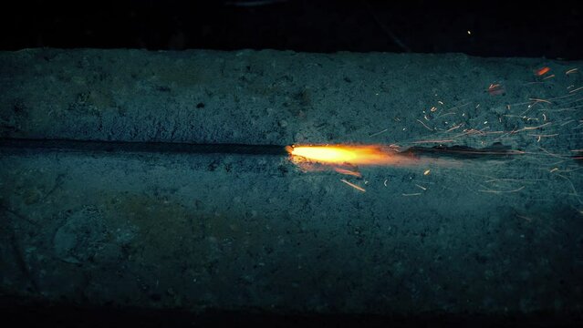 Fuse Burns Across Concrete Surface