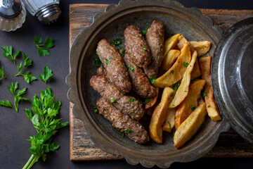 Traditional Turkish food; dry meatballs or inegöl meatballs with potatoes (Turkish name; Kuru kofte or anne koftesi)