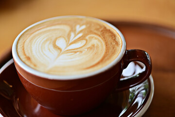 high angle view of coffee cup on wood grain table Drinking Concept: Hot Coffee, Latte, Espresso, Cappuccino