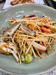 Traditional Som tum or Green papaya salad in Thailand