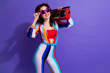 Photo of funky cool lady wear striped overall listening boom box discotheque songs empty space...