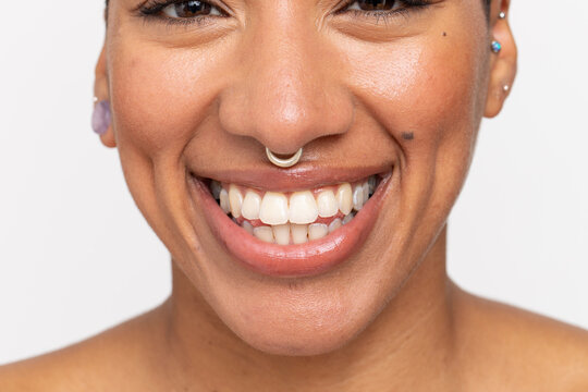 Close-up of smiling woman with nose ring