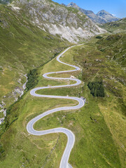 Aerial view of the winding road over the  Julier Pass in Swiss Alps mountain in summer, Canton...