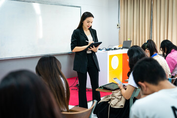 University lecturer teaching students in classroom
