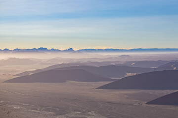 Naklejka na ściany i meble Namibia, aerial view of the Namib desert, sunrise, in rain season 