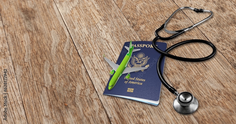 Poster Air traveling concept. passports and stethoscope on desk