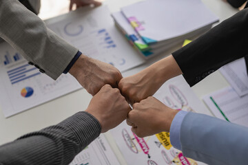 A group of business people join hands to successfully make contact, work as a team to achieve goals, hand-to-hand coordination is a symbol of unity within the organization to strive for success.