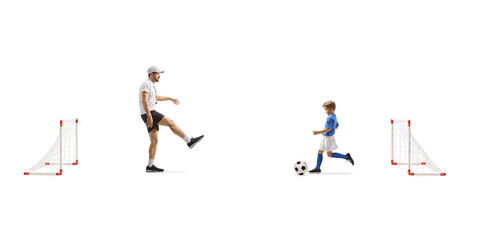 Boy practicing football with a coach