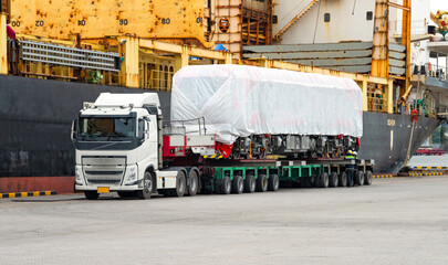 Transport of Oversize Heavy cargo trailera new diesel-electric locomotive on a multi-axle hydraulic...