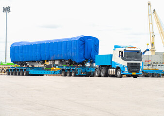 Transport of Oversize Heavy cargo trailera new passenger train on a multi-axle hydraulic modular...