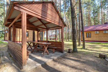 wooden eco country houses in forest