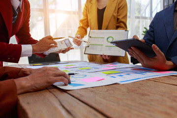 business people meeting Describe the success of your business in the last quarter, and analyze, plan, and next metrics using charts, laptops, iPads, and calculators. business and finance idea