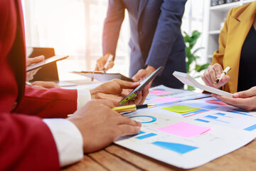 business people meeting Describe the success of your business in the last quarter, and analyze, plan, and next metrics using charts, laptops, iPads, and calculators. business and finance idea