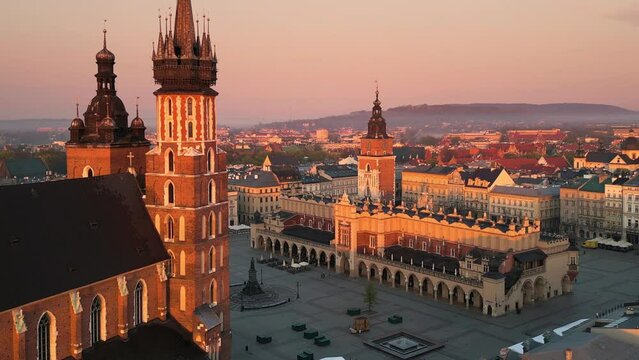krakow city old town aerial view seen from inside the room,drone flying out the window at sunrise,sunny day poland