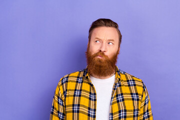 Photo of minded person look interested empty space contemplate hesitate isolated on violet color background