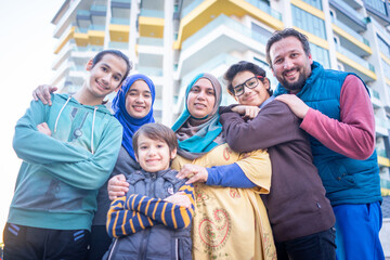 Real Muslim family on city street together