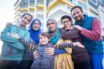 Real Muslim family on city street together