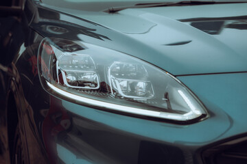Fototapeta na wymiar Close-up photo of a car headlight