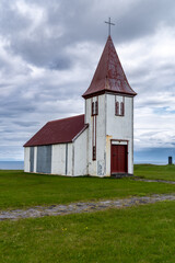 Fototapeta na wymiar The village church in Hellnar, an old fishing village in the Snaefellsnes peninsula of Iceland