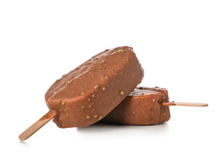 Delicious chocolate covered ice cream on stick against white background