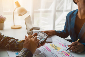 A group of investors and business teams are discussing investment trends for the best results. The concept of hiring an investment consultant to get highly efficient investment advice.