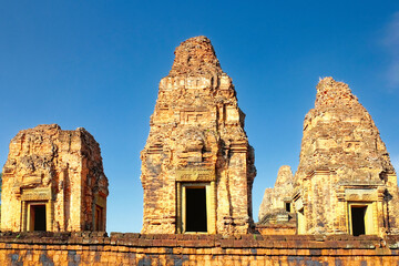 High-resolution image capturing the three monumental brick towers of the Pre Rup temple, standing...