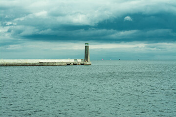 Naklejka na ściany i meble Lighthouse in Gdynia on the Baltic Sea in cloudy weather