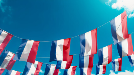 Obraz premium Flag of Netherlands against the sky, flags hanging vertically