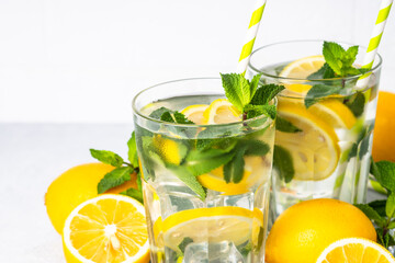 Lemonade in glass on white table.
