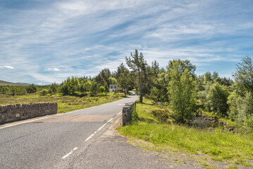 Fototapeta na wymiar Cairngorm National Park and Dalwhinnie Distillery viewsduring a sunny day, Highlands, Scotland