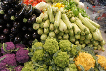 Vegetables in the store counter. Eggplant, zucchini, cauliflower in the market. Healthy vegetarian products.
