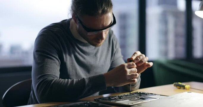 Hardware, maintenance and screwdriver with man in office for technician, programming and engineer. Developer, tools and electrician with male employee for technology, handyman and laptop repair