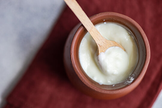 Traditional serving of Georgian sour yogurt known as Matsoni in clay pot