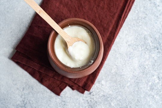 Traditional serving of Georgian sour yogurt known as Matsoni in clay pot
