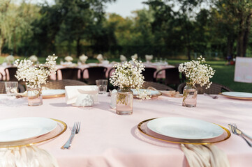 On the table is a decorative vase with dried flowers. Beautiful summer location for relaxation