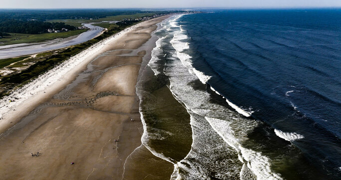 Ogunquit beach at low tide in Ogunquit Maine midday.
