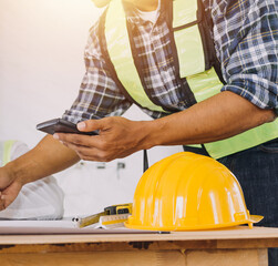 Professional Mechanical Engineer team Working on Personal Computer at Metal lathe industrial...