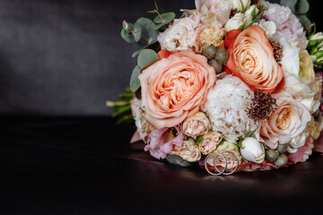 Wedding bouquet and rings. Background for congratulations on Women's Day, International Women's Day, wedding invitations.