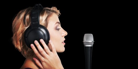 A youn woman voice actress reading a script.