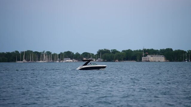 Motorboat Cruising Past Toronto Islands on Lake Ontario