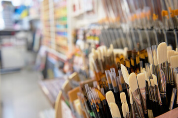 Paintbrushes with synthetic and natural bristles of different softness displayed for sale in the...