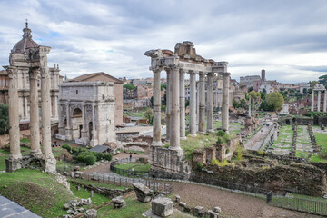 Fototapeta na wymiar Rome, Italy - 27 Nov, 2022: The Temple of Saturn and views along the Roman Forum