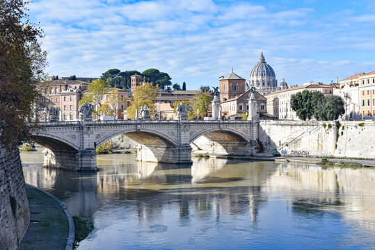 Rome, Italy - 26 Nov, 2022: View of St. Peter's Basilica and bridges over the Tiber river