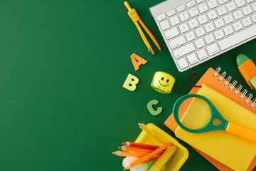 Delving into the opportunities of distant learning. Top view flat lay of assorted stationery, keyboard, letters on green background with empty space for promo or text
