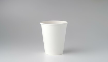 Disposable White Paper Cup for Drinks Mockup on White Table with Gray Background