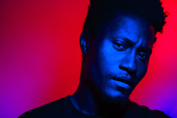 black model in colourful studio